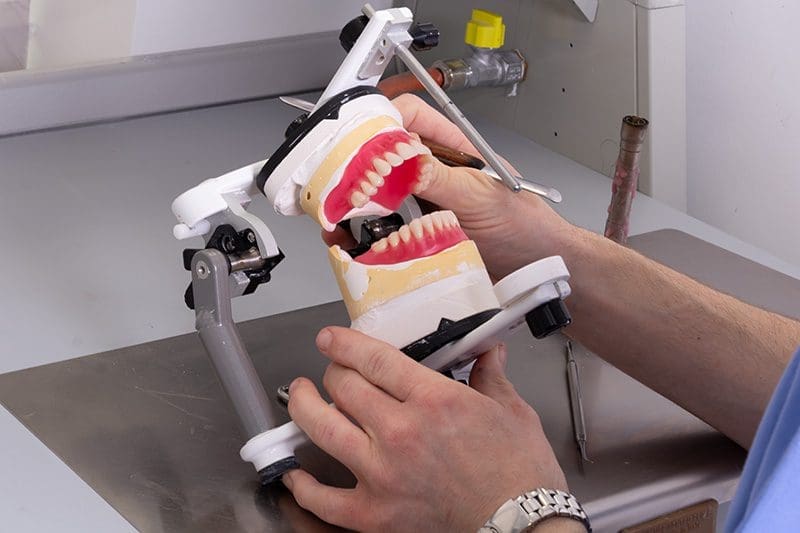 Denture technician working in our Dudley laboratory